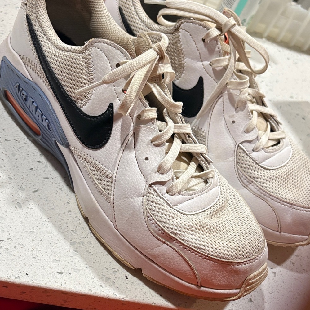 Nike White Sneakers with Black Swoosh and Blue Accent